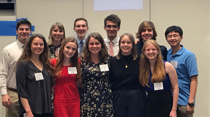 A group photo of 11 student researchers.